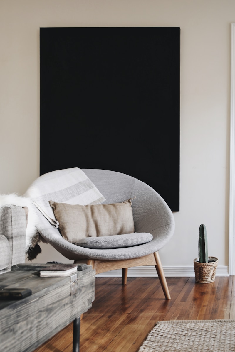 Photo by avery klein round grey moon chair with brown pillow on top